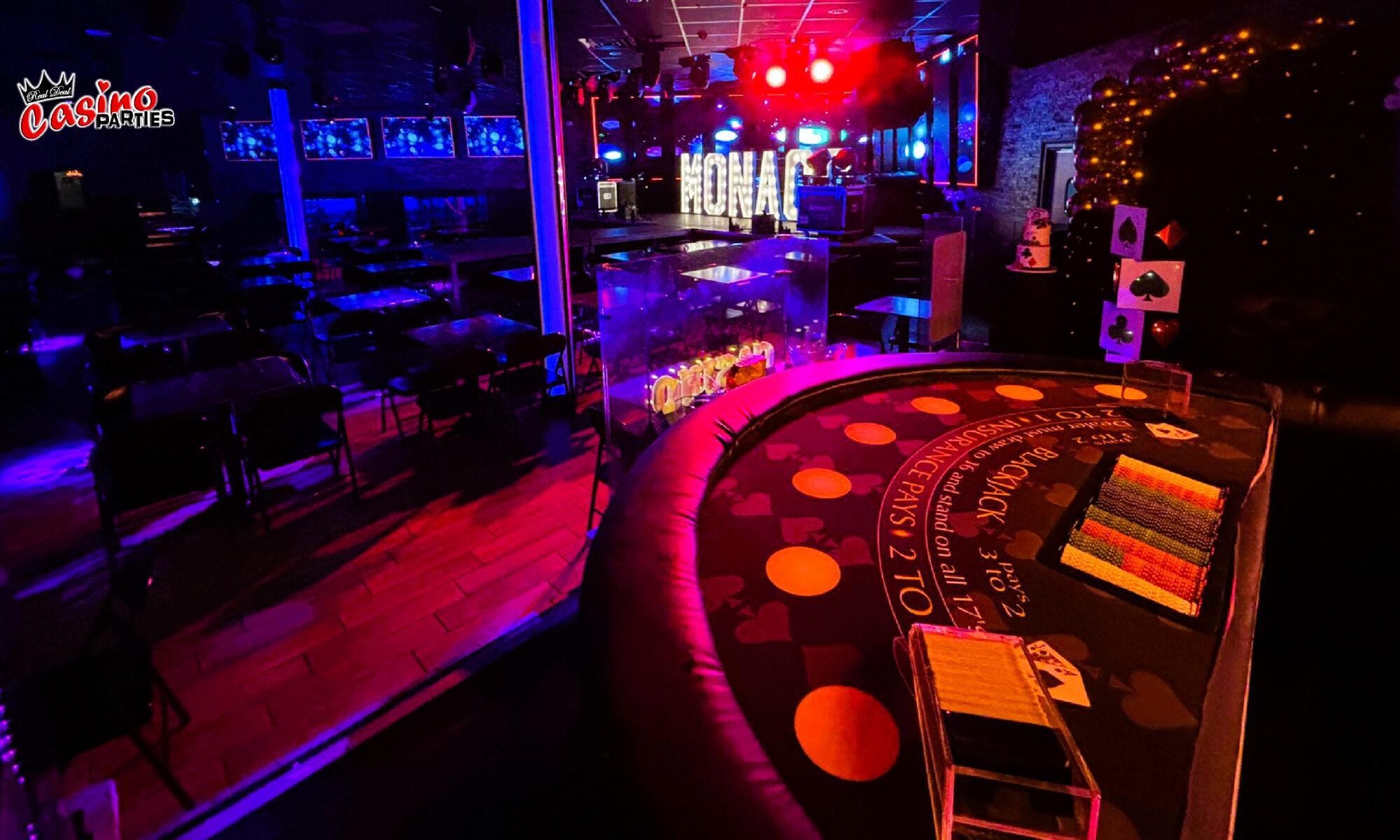 Professional blackjack table with chips at a neon-lit themed casino party rentals Tampa experts!.